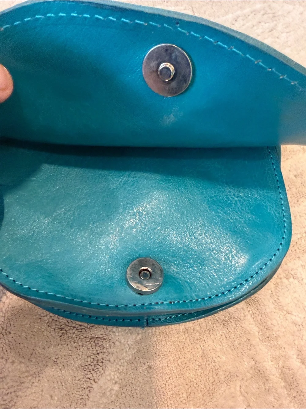 Vintage Florence Made in Italy genuine leather crossbody saddle bag in teal.
